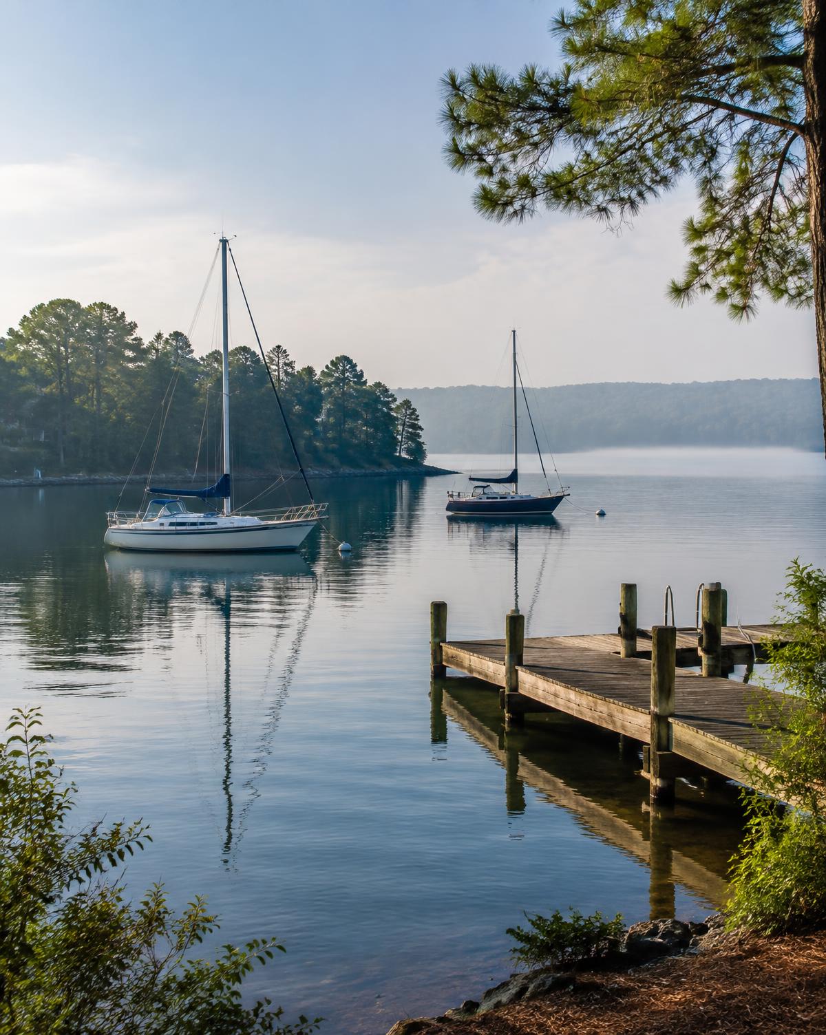 Sailboats resting in a quiet Lake Norman cove